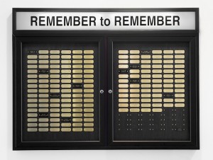 Cheryl Pope, “Remember to Remember” (2013), metal display case, brass name plates, fluorescent light (courtesy Monique Meloche Gallery)