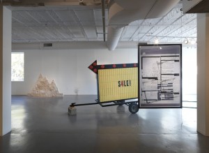 From left to right: Assaf Evron, “Untitled (Egyptian Embassy Tel Aviv),” 2013. Dry wall, split-face blocks, and acrylic. 6′ x 5′; Conrad Bakker, “Untitled Project: SIGN [Relax and Take Your Fucking Time],” (2013), oil paint on carved wood, 82 x 108 x 58 inches; Aaron Van Dyke, “Untitled” (2013), inkjet print (double-sided), 42 x 64 inches. (all images courtesy of Hyde Park Art Center unless otherwise noted)